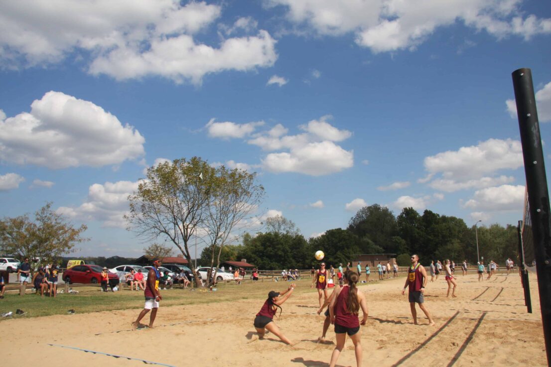 students playing sand volleyball at House Olympics
