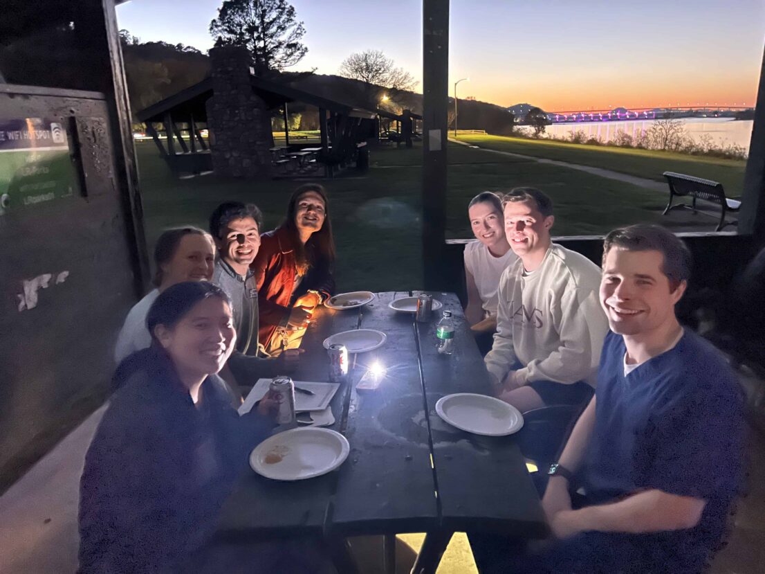 Ish House students around a picnic table