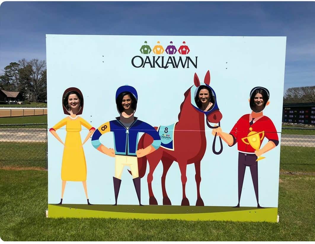 residents posing in a jockey sign at Oaklawn race track