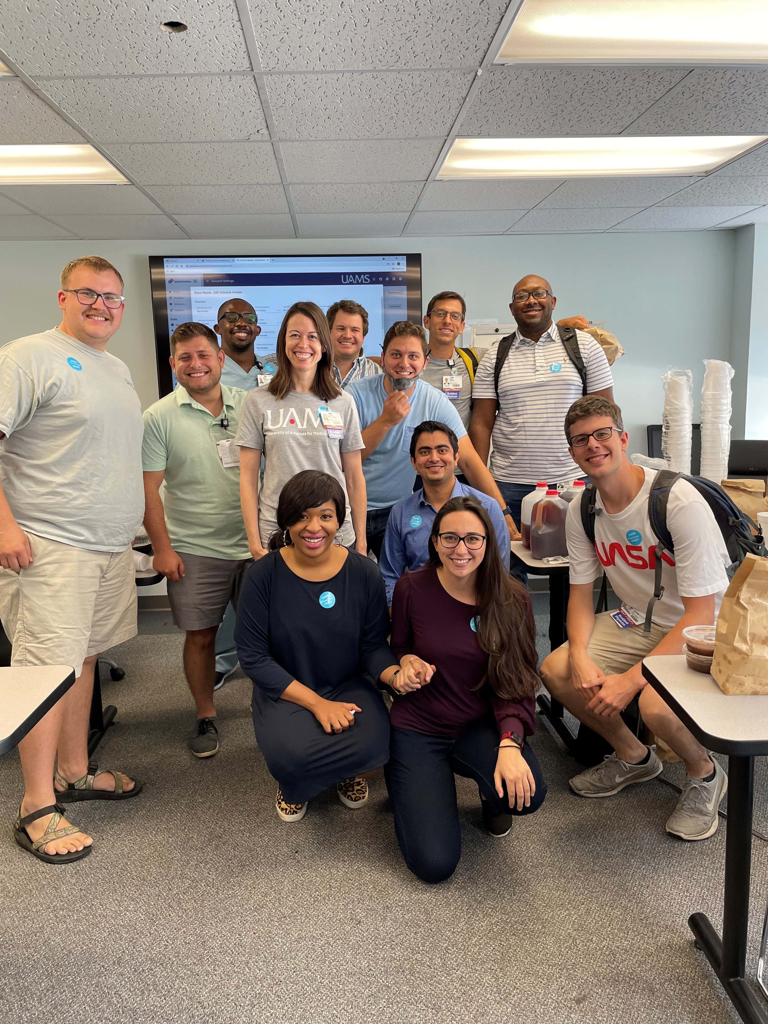 new residents (class of 2025) pose in a classroom