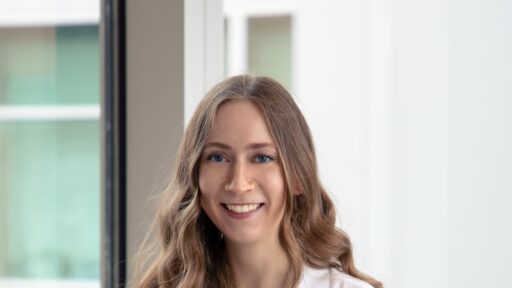 Photo of Haven Griffin in a white coat.