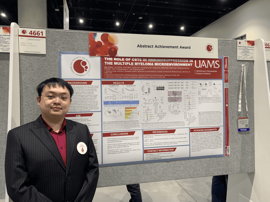 Zijun Zhang with his poster at the American Society of Hematology annual meeting