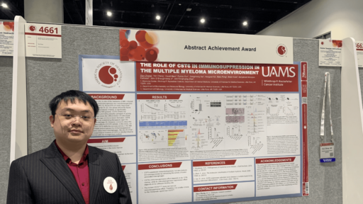 Zijun Zhang with his poster at the American Society of Hematology annual meeting