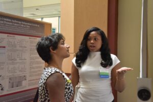 Chelsea Cliff presenting her poster