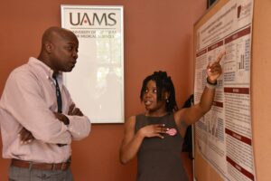 Praise Fabiya presenting her poster