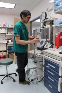 Person standing in front of Telemed cart