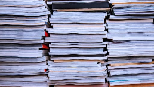 image showing stacks of books, representing research publications