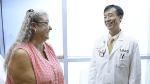 Dr. Wong with a patient in clinic