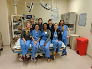 a group of faculty and resident women posing in the ER