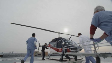 emergency faculty race to meet a helicopter on the roof helipad at UAMS