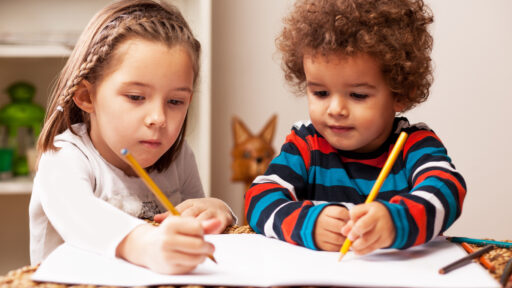 Young girl and boy drawing