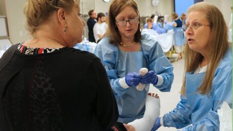 2 nurses casting lady's foot