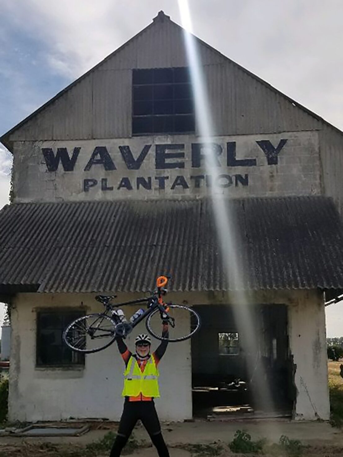 Picture of bicyclist holding bike at Waverly Plantation