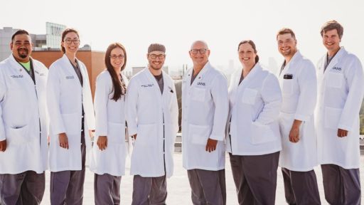 Trauma faculty posing on helipad