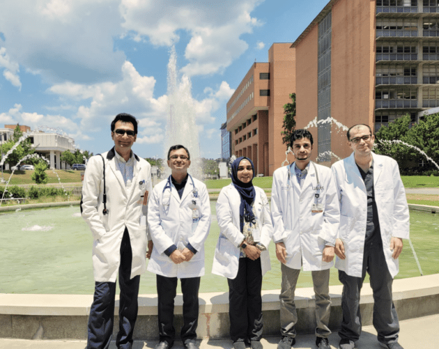 Nephrology fellows posing in front of the UAMS fountain