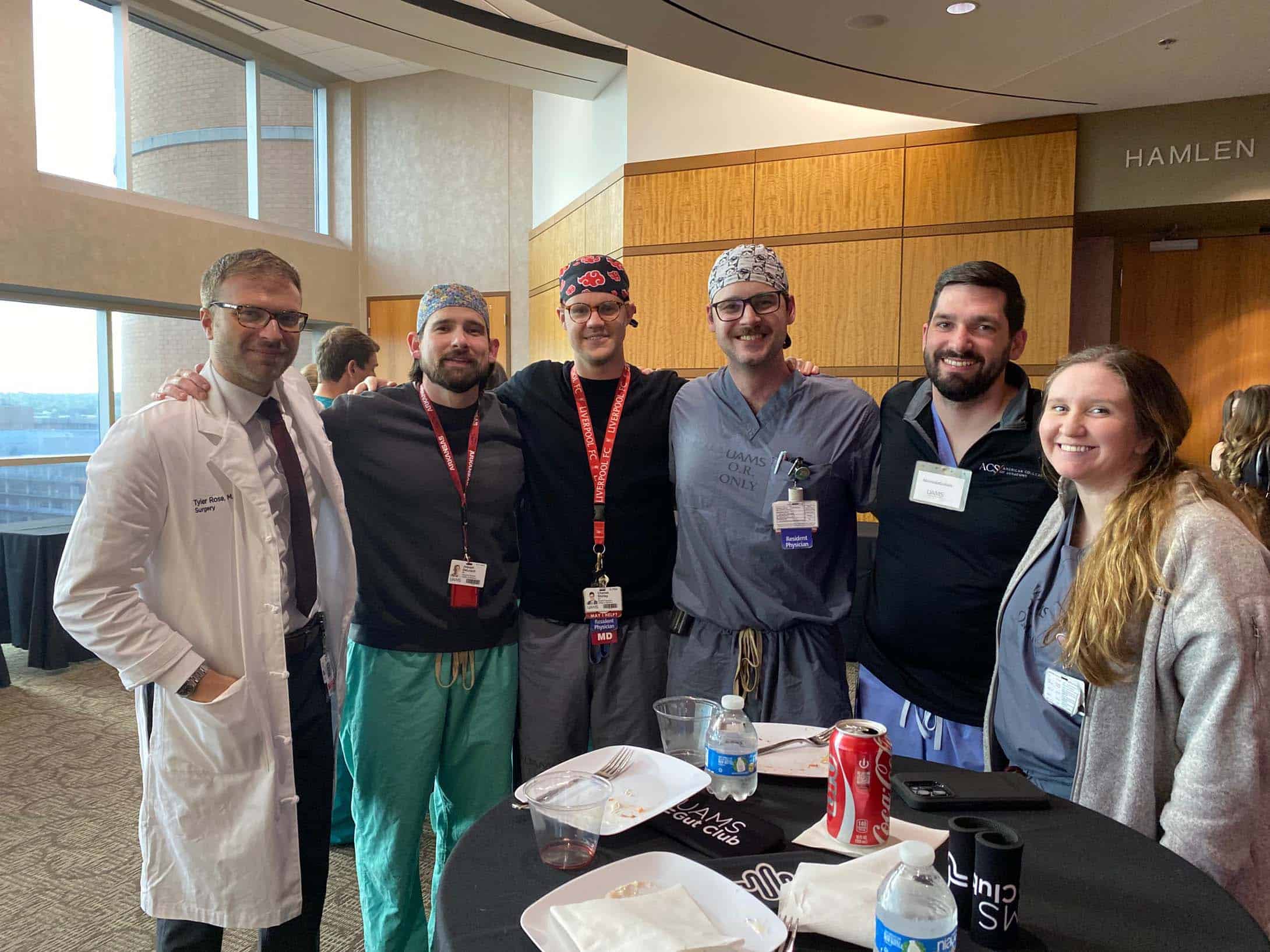 A group of doctors posing for a photo at a conference