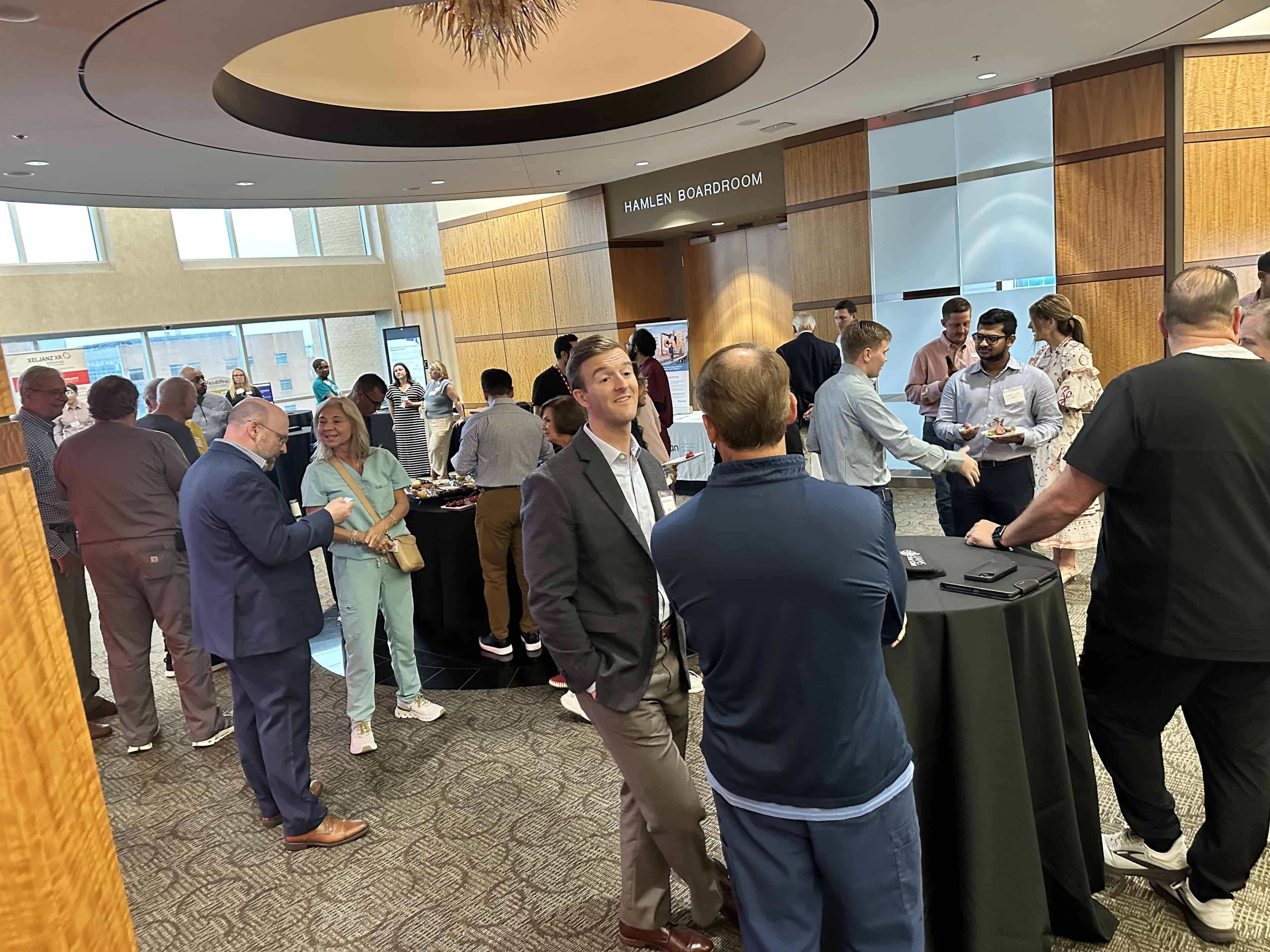 Shot of the lobby at Gut Club, large group of people are conversing