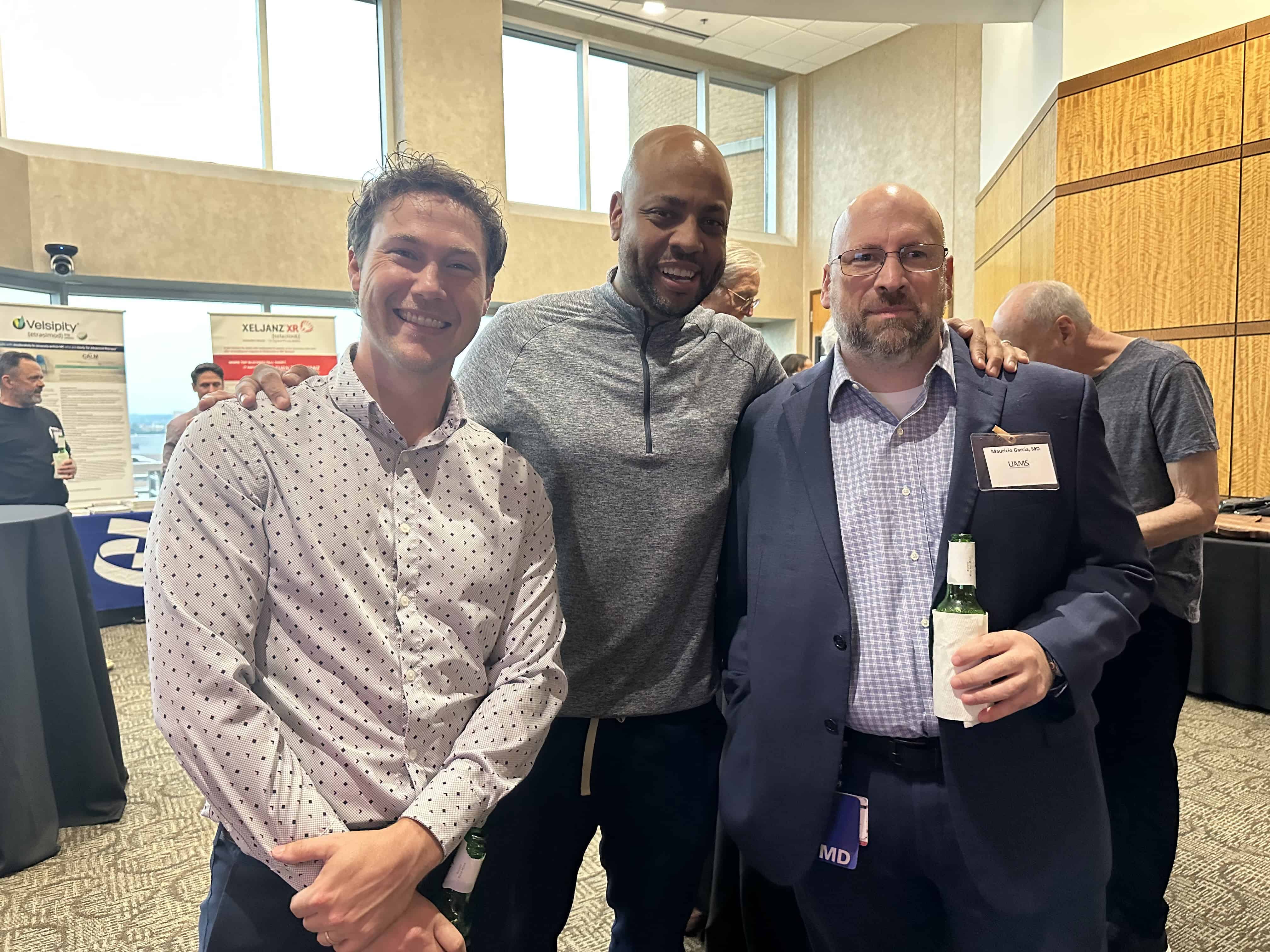 Three people posing at the Gut Club event