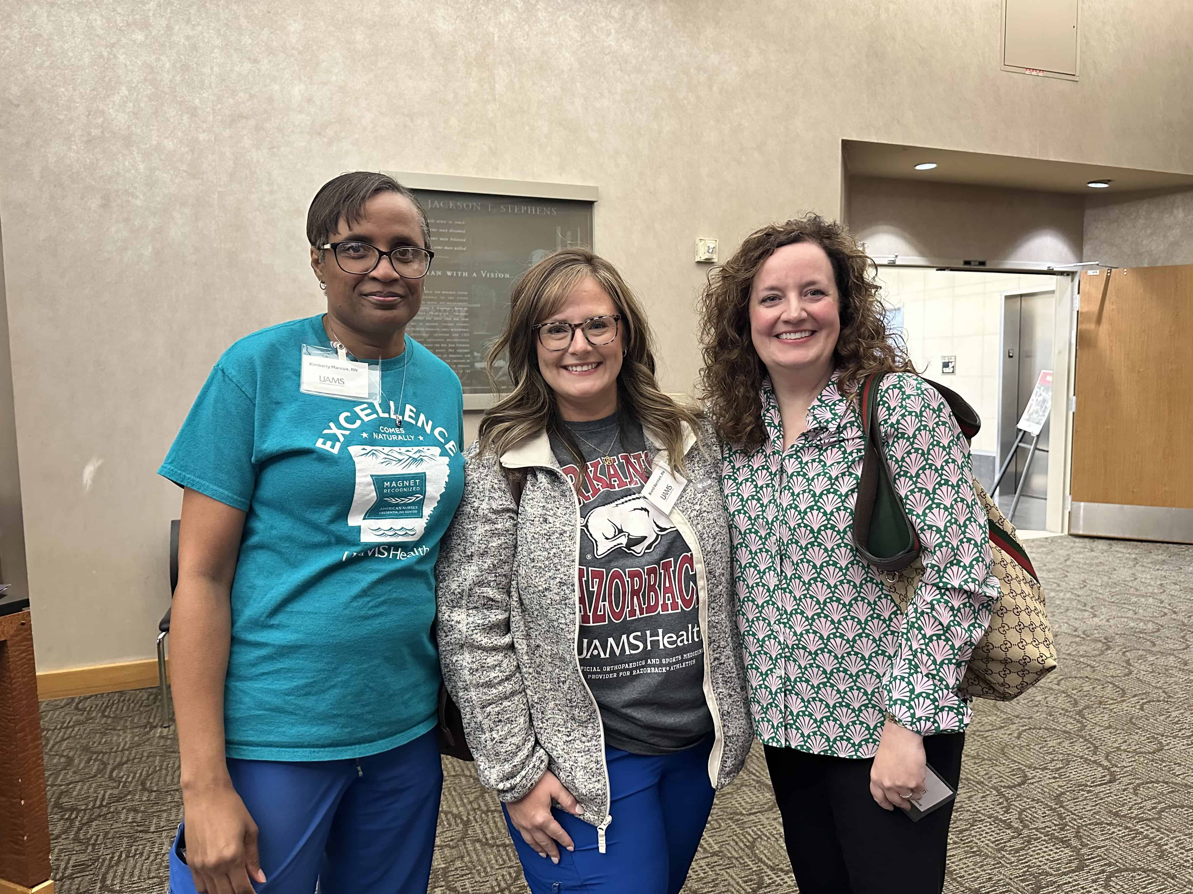 Three people posing at the Gut Club event