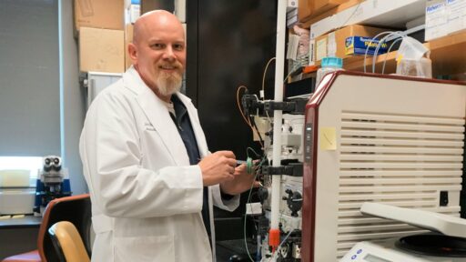 Dr. Blevins poses in a lab