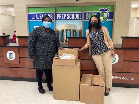 JA Fair Middle School Teacher Lawanna Harris (right) and her Principal with their ArkanSONO 2022 STEM grant supplies.