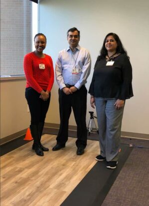 Dr. Virmani with lab members standing in the Gait Lab