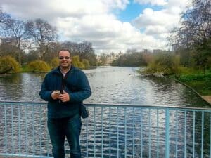 Moustafa Aly, M.D., posing in front of a river