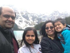 Nayana Prabhu and family in front of snow covered mountains