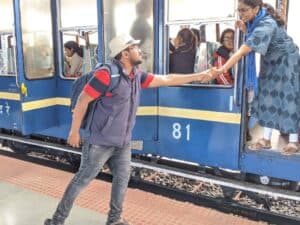 Abhilash Thatikala reaching out to a woman on a train