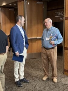 two men talking in the lobby during the ANS meeting