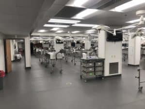 Interior of the gross anatomy lab, showing tables, lights, and computer monitors