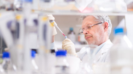 Scientist researching in laboratory.