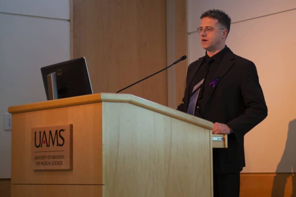 Viktoras Palys, M.D. speaks to the audience during the epilepsy symposium.
