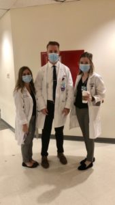 PGY-1 residents wearing masks and white coats