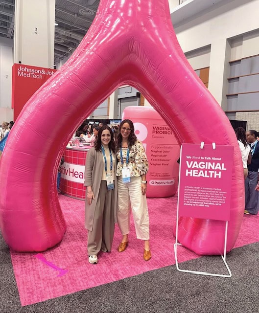 two women at a OBGYN conference