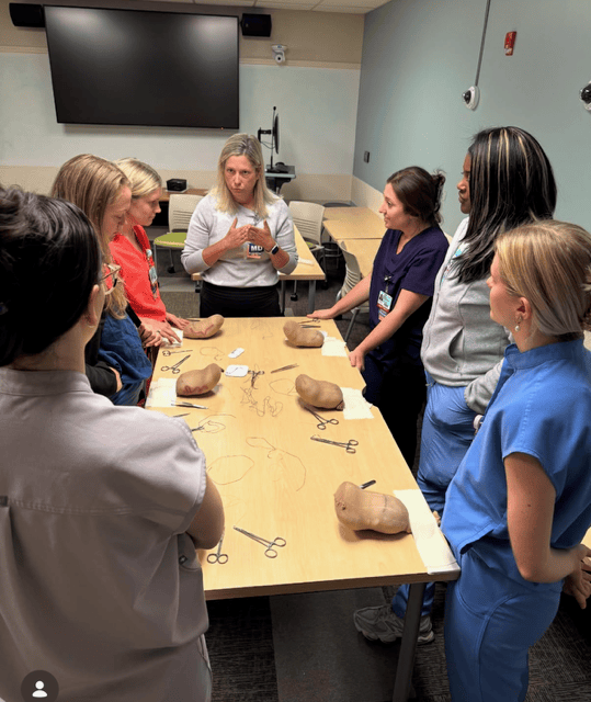 a group of residents learning surgical techniques