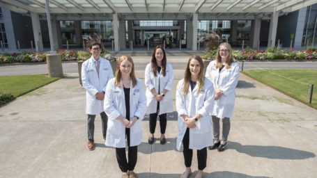 Group of Ob-Gyn residents posing in front of the UAMS Medical Center
