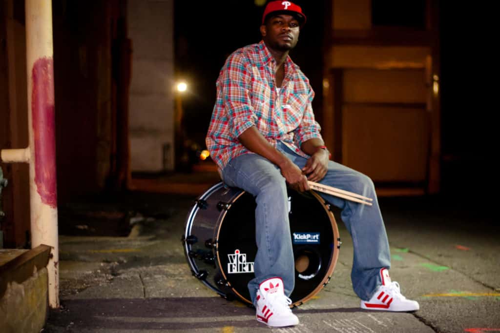 Paul Campbell poses with bass drum and sticks