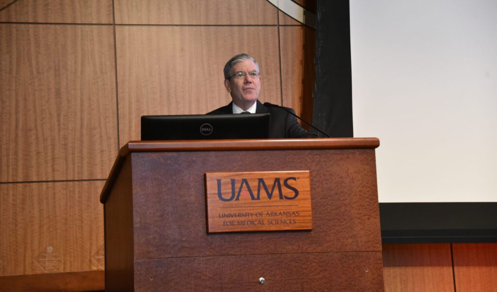 John Dornhoffer, M.D., speaking at a podium