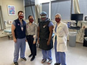 Doctors posing in masks and PPE