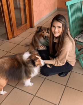 Woman posing with two border collies