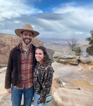 Dr. Hart and her husband posing in a desert area