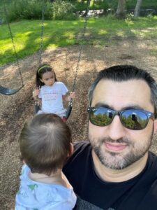 Taha Keskin and children at a playground
