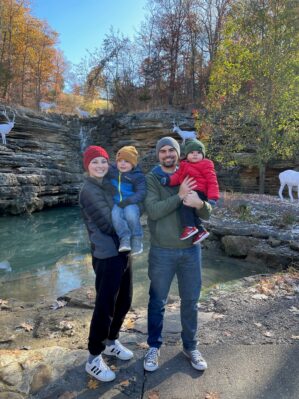 Logan Meurer with family outdoors near a waterfall
