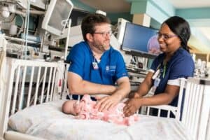 Neonatologist Ashley Ross evaluates a neonate in the Arkansas Children’s Hospital NICU