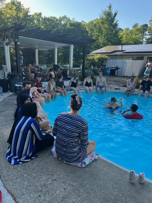 Pediatric residents hang out by the swimming pool and socialize