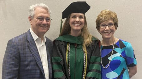 Dr. Katie Beaton, a UAMS Pediatric Resident, poses with her parents. Her mom, Dr. Janet Udouj, was a UAMS Pediatrics Resident in 1982.
