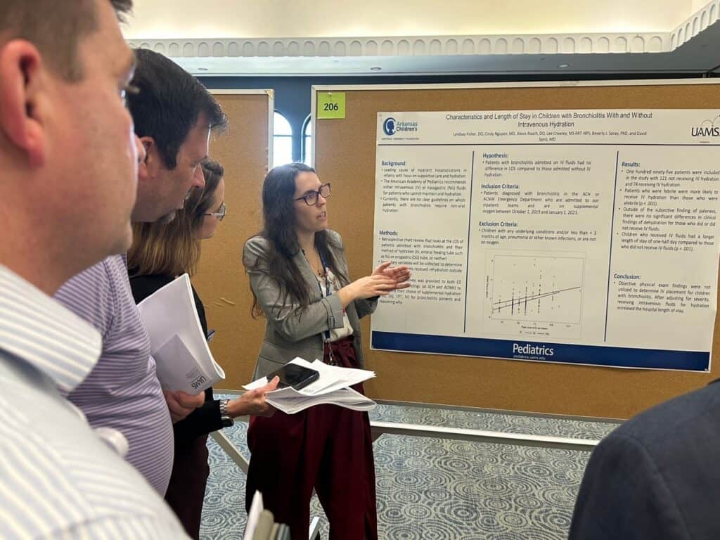 Dr. Lyndsay Fisher presents her research poster during Fellows' Research Forum 2024