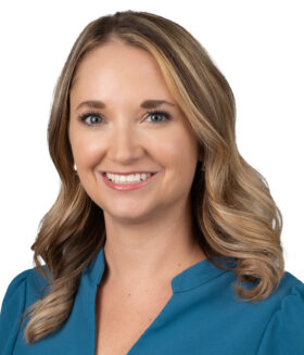 Hannah Aston, Manager Research Strategic Initiatives, Blonde hair and wearing a blue shirt