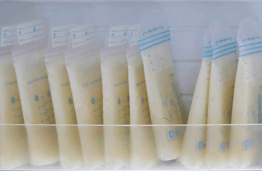 freezer bags of breast milk stacked vertically